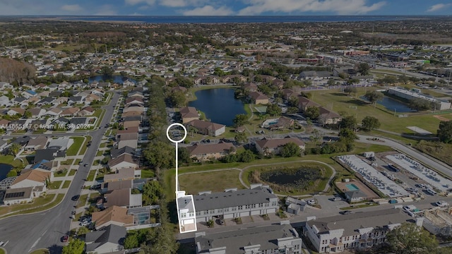 birds eye view of property with a water view