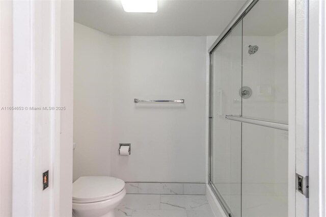 bathroom with toilet and walk in shower