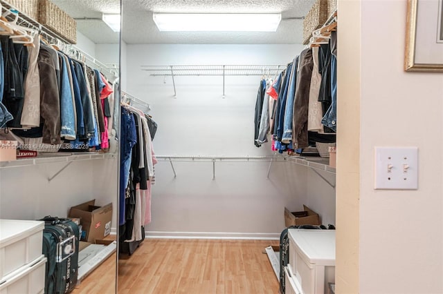 spacious closet with wood finished floors