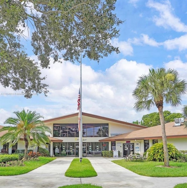 view of property with concrete driveway