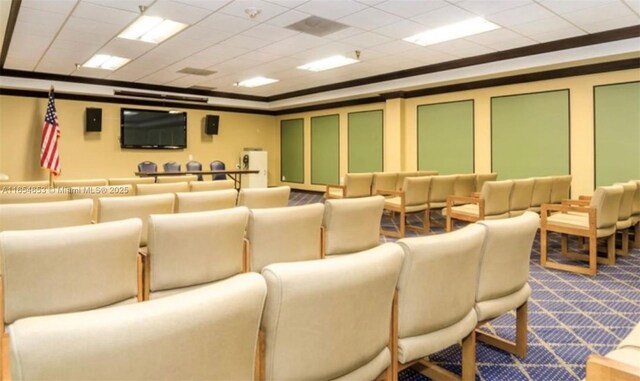 home theater featuring a drop ceiling and carpet flooring