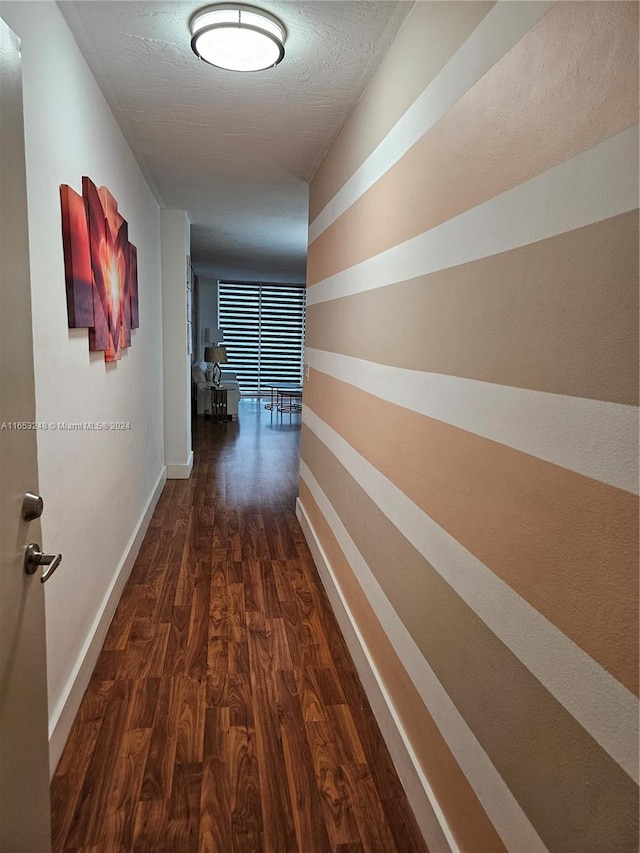 hallway featuring dark wood-type flooring