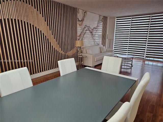 dining area with dark hardwood / wood-style floors