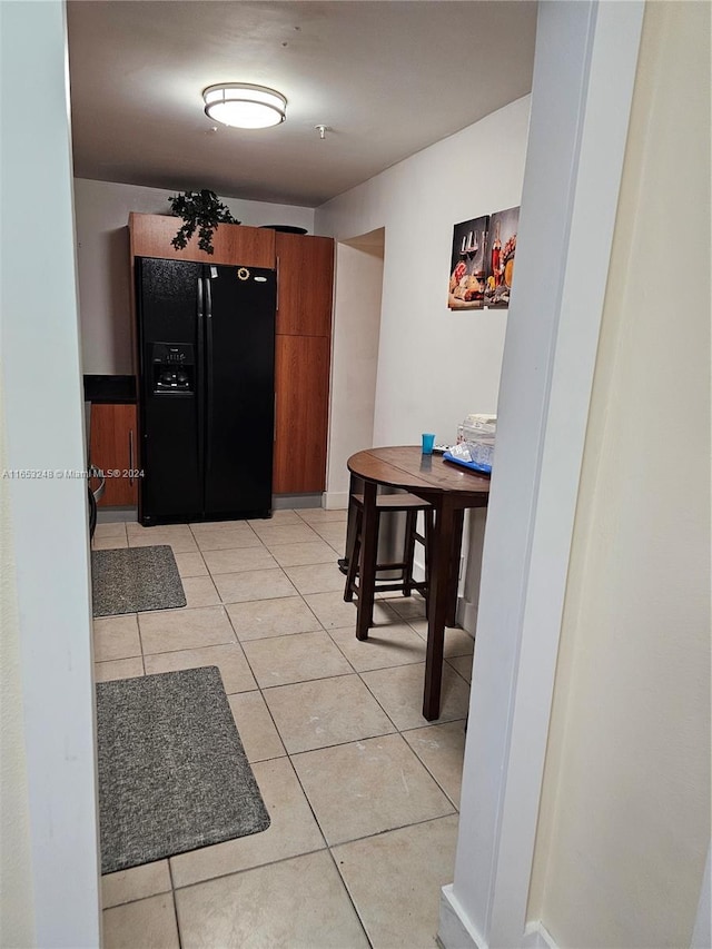 corridor with light tile patterned flooring