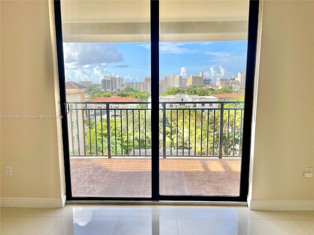 doorway to outside with tile patterned floors