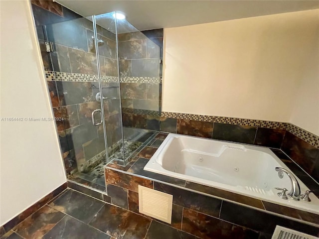 bathroom featuring plus walk in shower