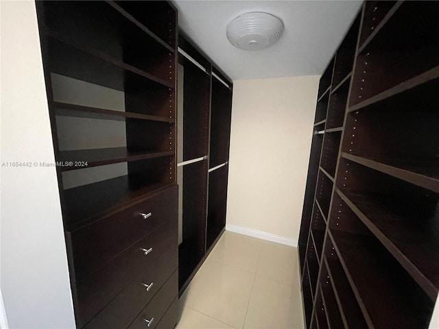 walk in closet featuring light tile patterned floors