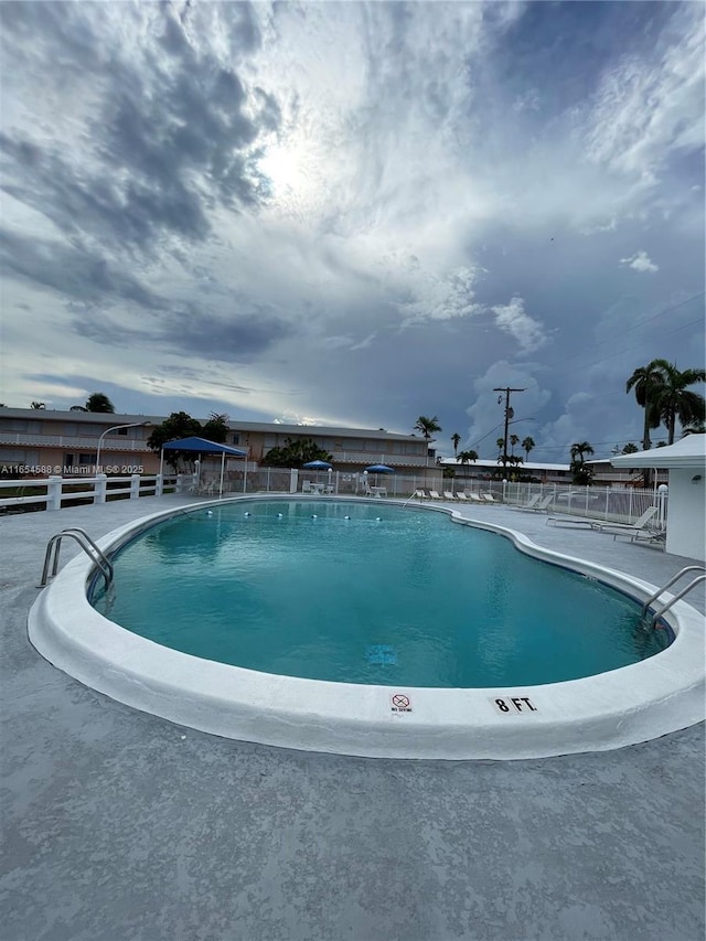 pool featuring fence