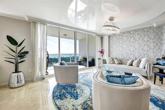 living room with crown molding and a chandelier