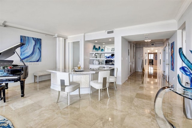 interior space featuring crown molding, a center island, marble finish floor, and visible vents