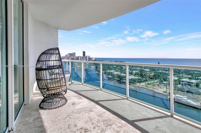 balcony featuring a water view