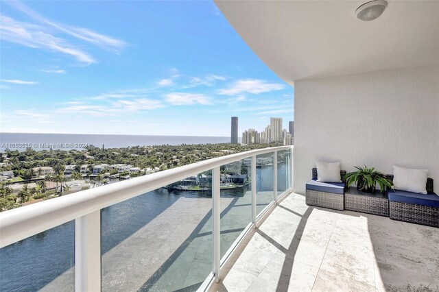 balcony featuring a water view and a view of city
