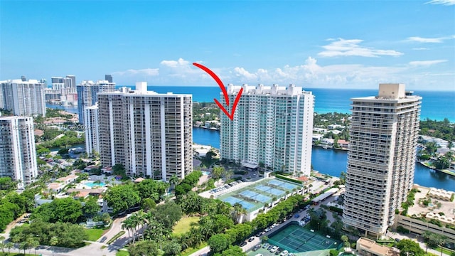 drone / aerial view featuring a water view and a city view