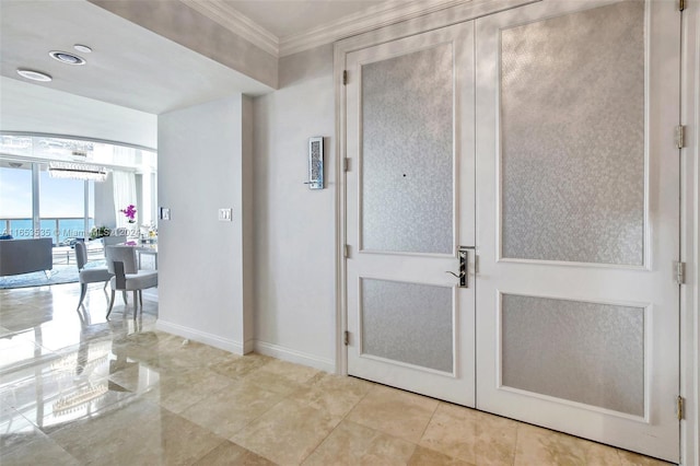 hallway featuring baseboards and ornamental molding