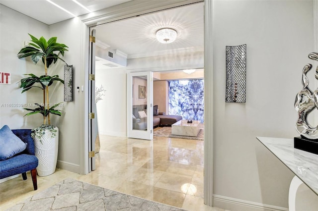 hallway featuring baseboards and visible vents