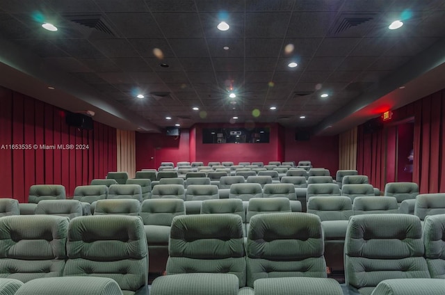 home theater room featuring recessed lighting, a paneled ceiling, and visible vents