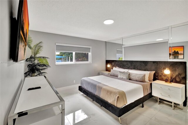 bedroom featuring a textured ceiling