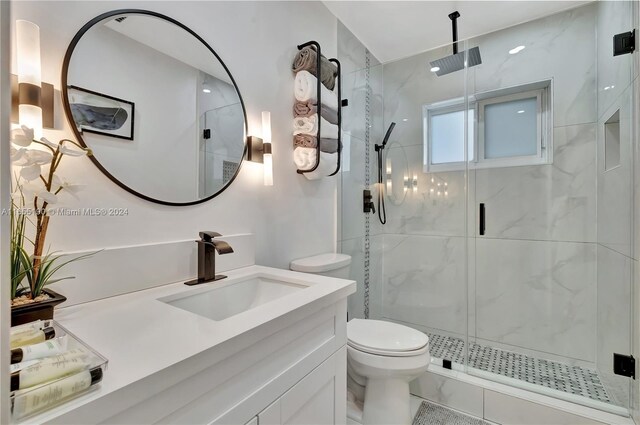 bathroom with walk in shower, tile patterned flooring, vanity, and toilet