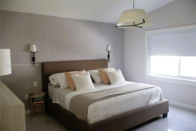 bedroom featuring lofted ceiling