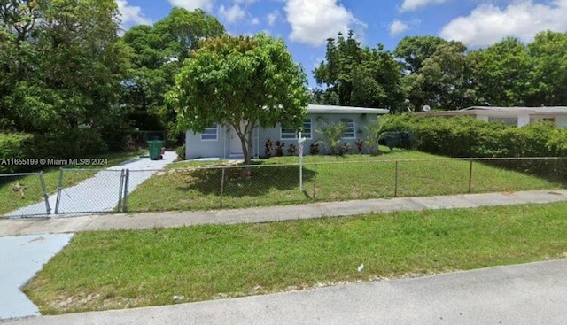 3571 NW 3rd St, Lauderhill, FL 33311 - view of community featuring a lawn