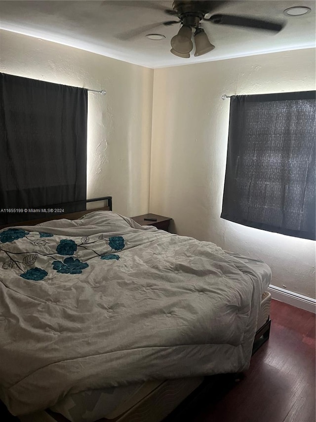 bedroom featuring ceiling fan and hardwood / wood-style flooring