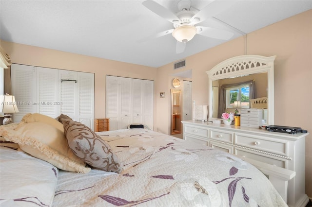 bedroom with two closets and ceiling fan