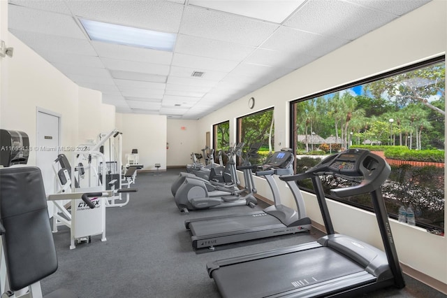 exercise room with a paneled ceiling