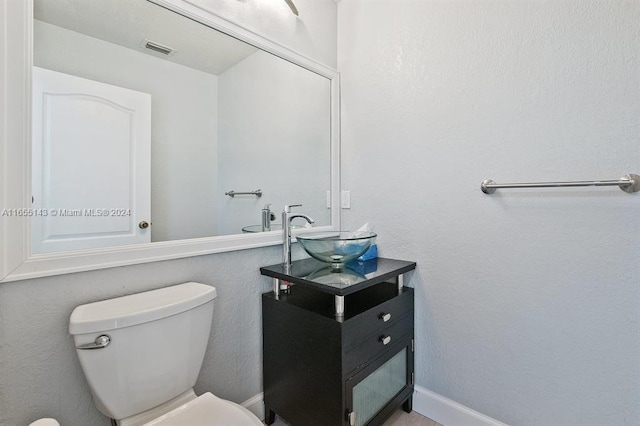 bathroom with sink and toilet