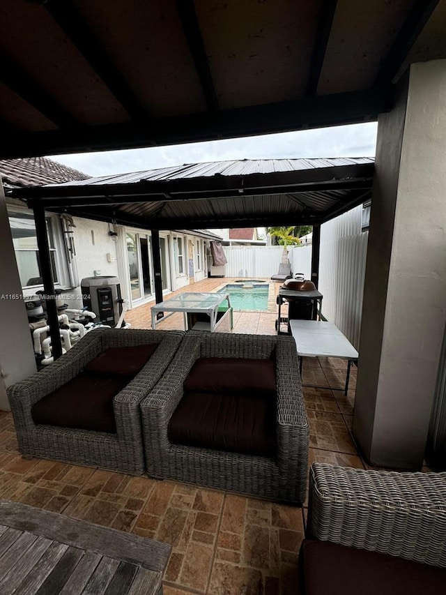 view of patio with a gazebo and a fenced in pool