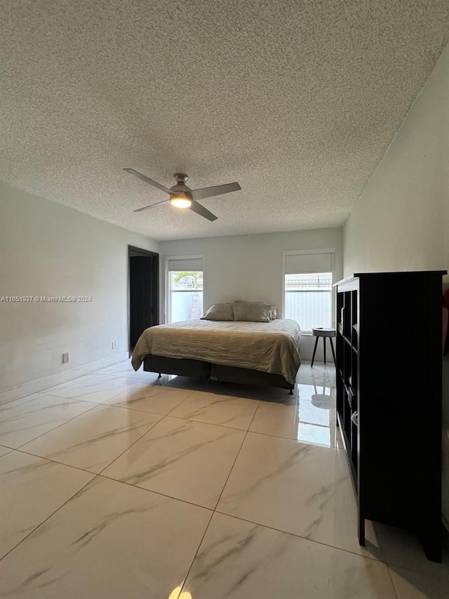 unfurnished bedroom with a textured ceiling and ceiling fan