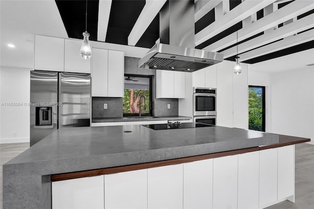 kitchen featuring white cabinetry, island exhaust hood, stainless steel appliances, sink, and hanging light fixtures