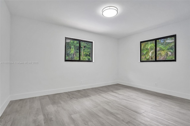 unfurnished room featuring light wood-type flooring