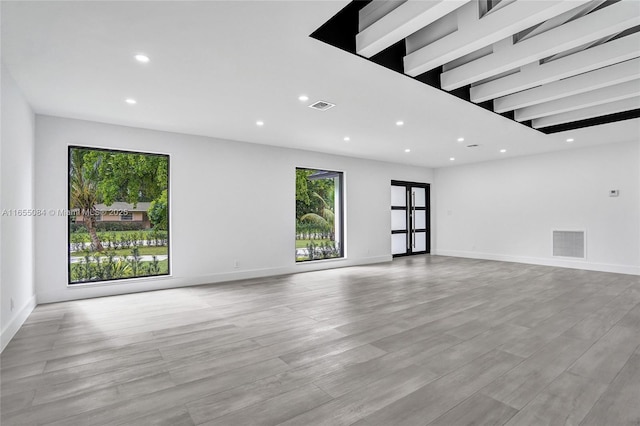 unfurnished living room featuring light hardwood / wood-style flooring