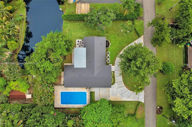 birds eye view of property with a water view