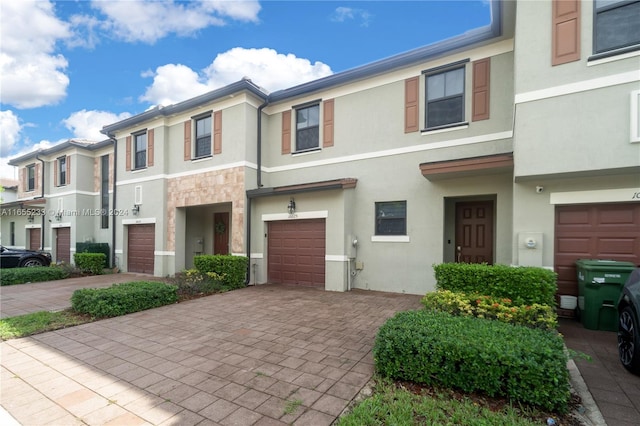 townhome / multi-family property featuring a garage