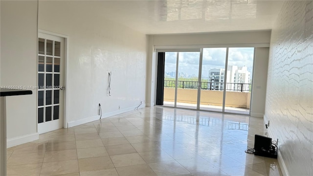 unfurnished room featuring light tile patterned floors