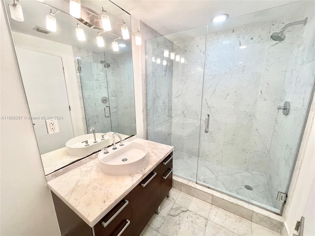 bathroom with vanity and an enclosed shower