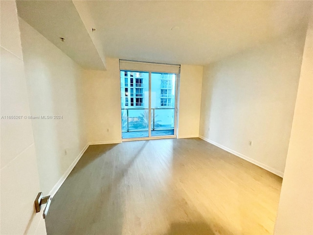 spare room featuring hardwood / wood-style floors