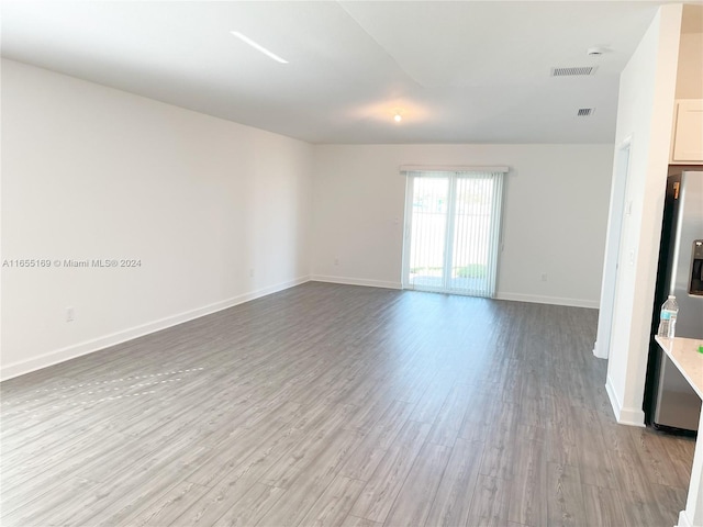 spare room featuring light hardwood / wood-style flooring