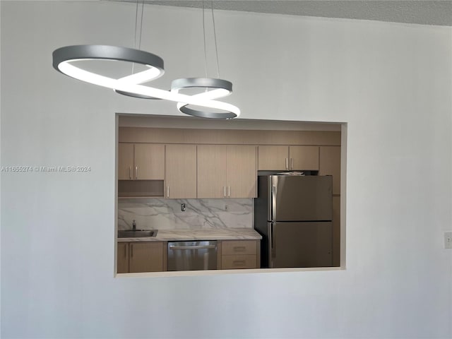 kitchen with light brown cabinetry, stainless steel appliances, tasteful backsplash, and sink