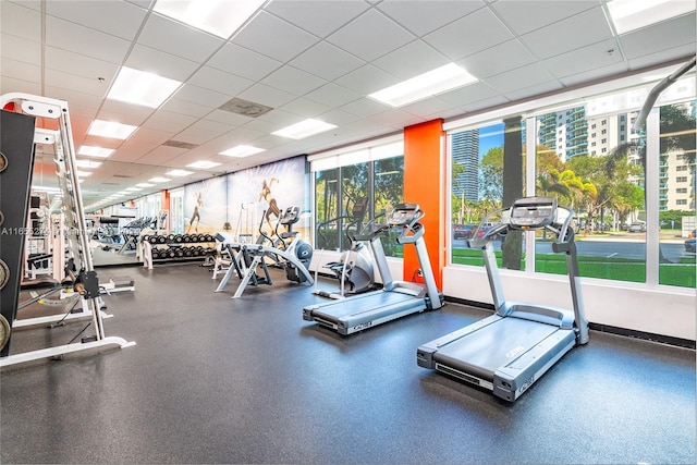 gym featuring a drop ceiling