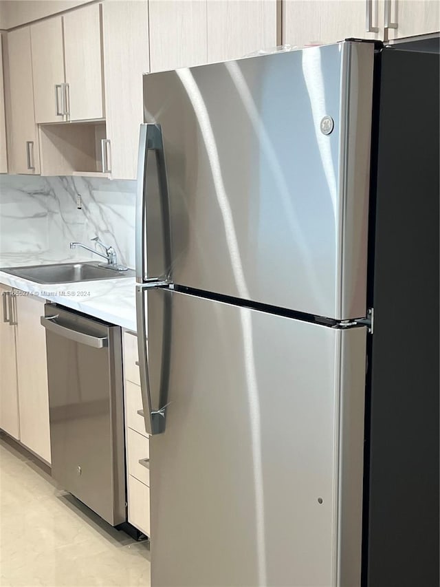 19380 Collins Ave Unit Ph-15, Sunny Isles Beach, FL 33160 - kitchen with appliances with stainless steel finishes, light countertops, a sink, and decorative backsplash