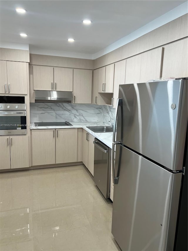 19380 Collins Ave Unit Ph-15, Sunny Isles Beach, FL 33160 - kitchen featuring stainless steel appliances, under cabinet range hood, light countertops, a sink, and light brown cabinetry