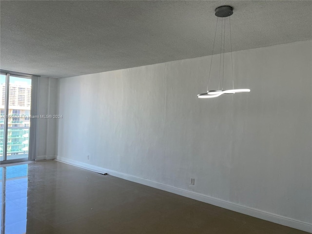 empty room with a textured ceiling