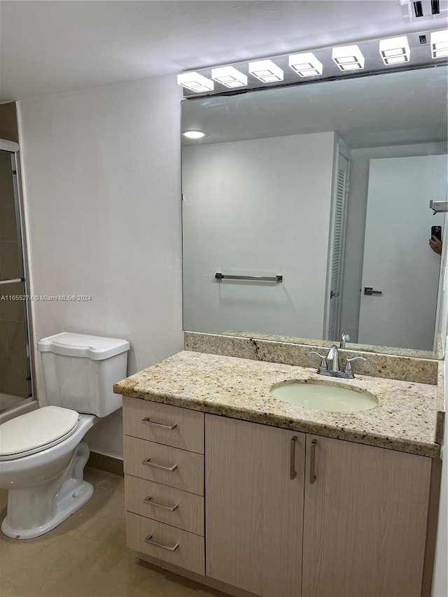 19380 Collins Ave Unit Ph-15, Sunny Isles Beach, FL 33160 - bathroom with vanity, toilet, and a shower with shower door