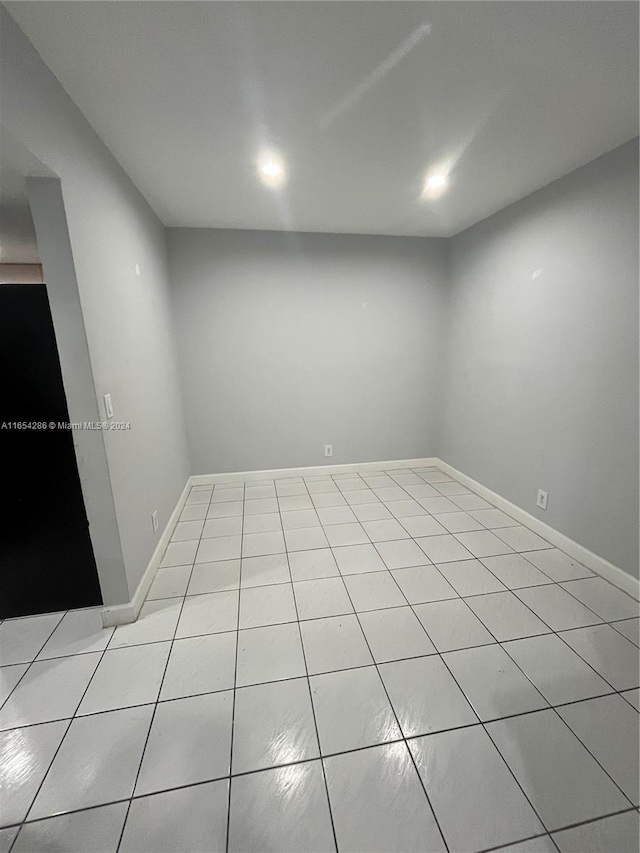 spare room with light tile patterned flooring