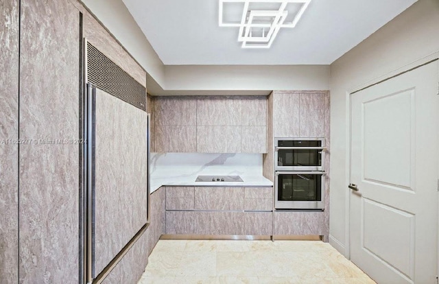 kitchen featuring stainless steel double oven, black electric cooktop, light brown cabinetry, and tile patterned floors