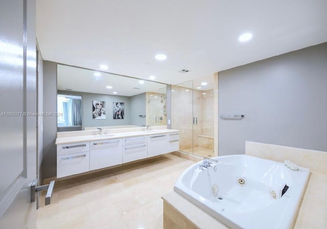 bathroom with vanity and plus walk in shower