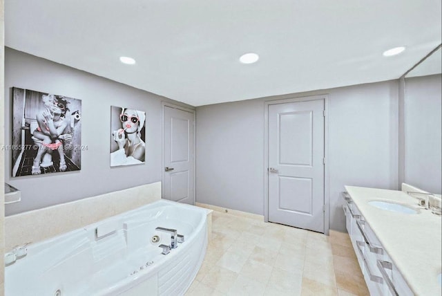 bathroom with a tub to relax in and vanity