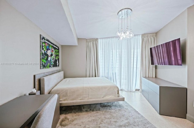 bedroom featuring an inviting chandelier